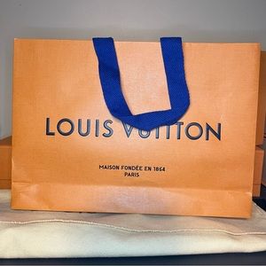 Louis Vuitton, orange paper gift bag with blue handle
